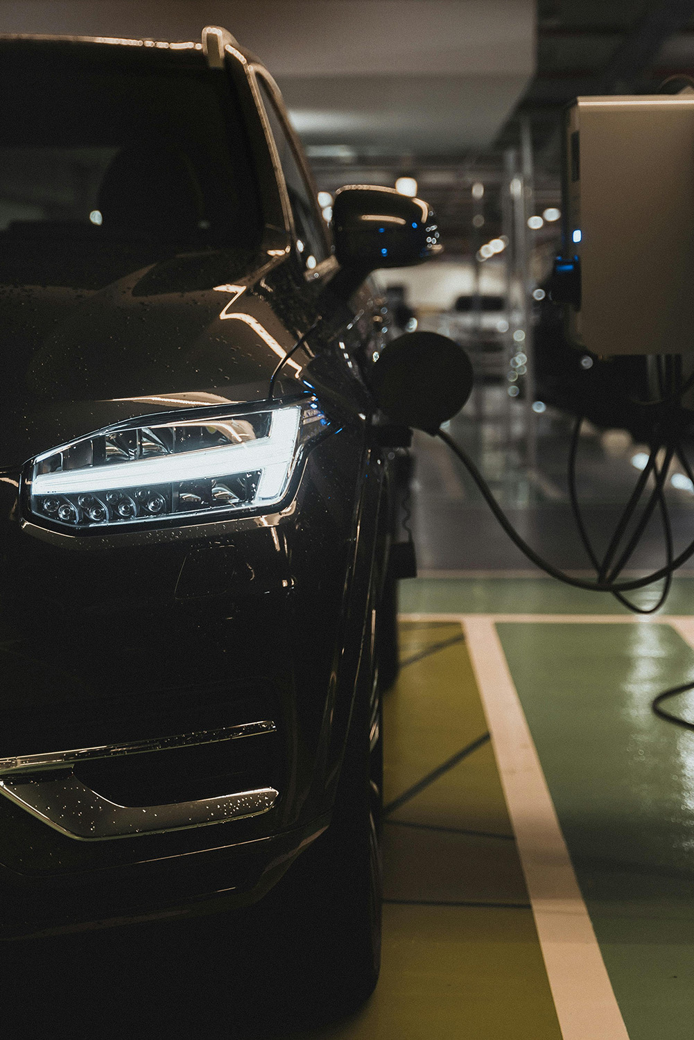 Charging electric car in a garage