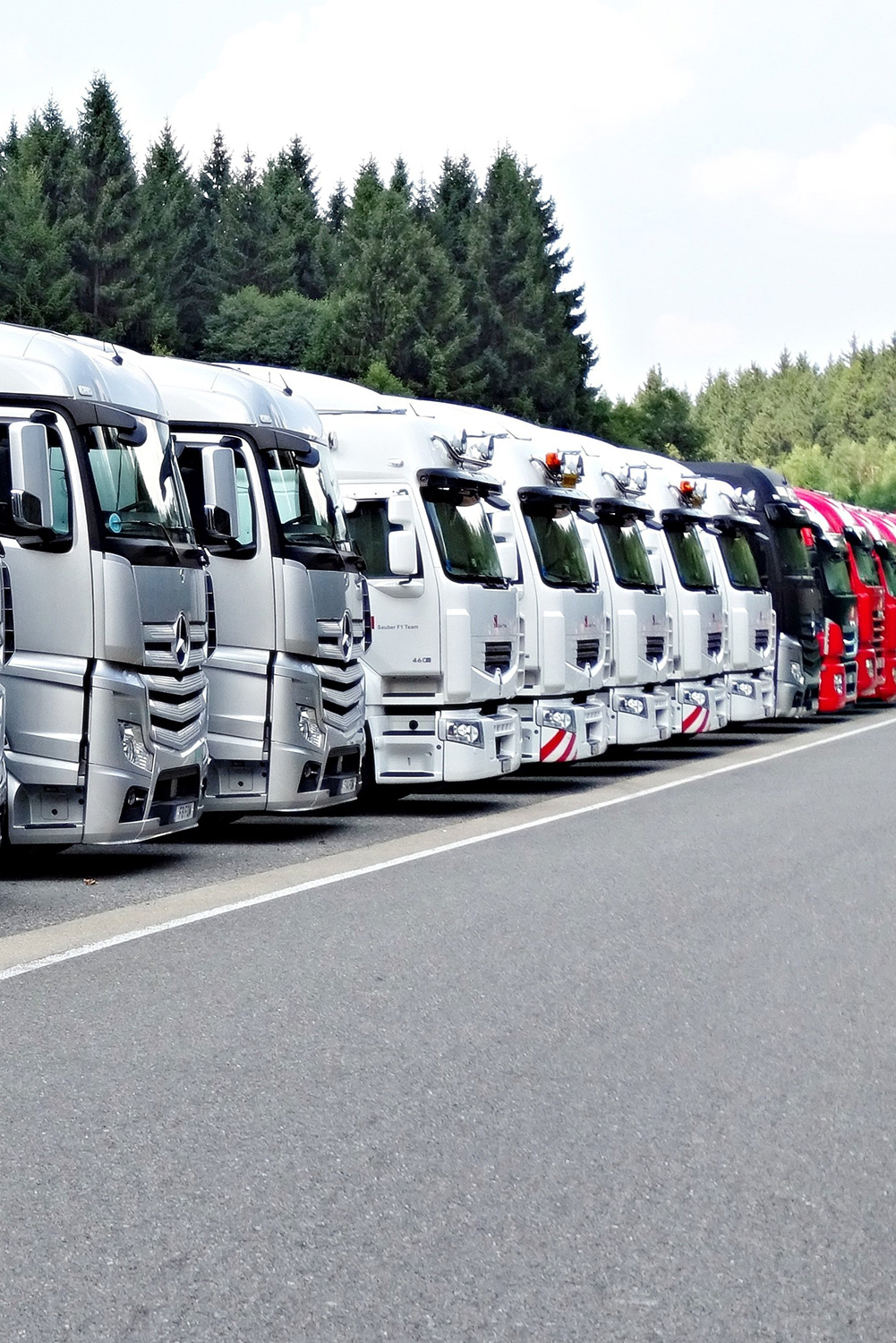 Truck fleet on a parking behind a tolling station