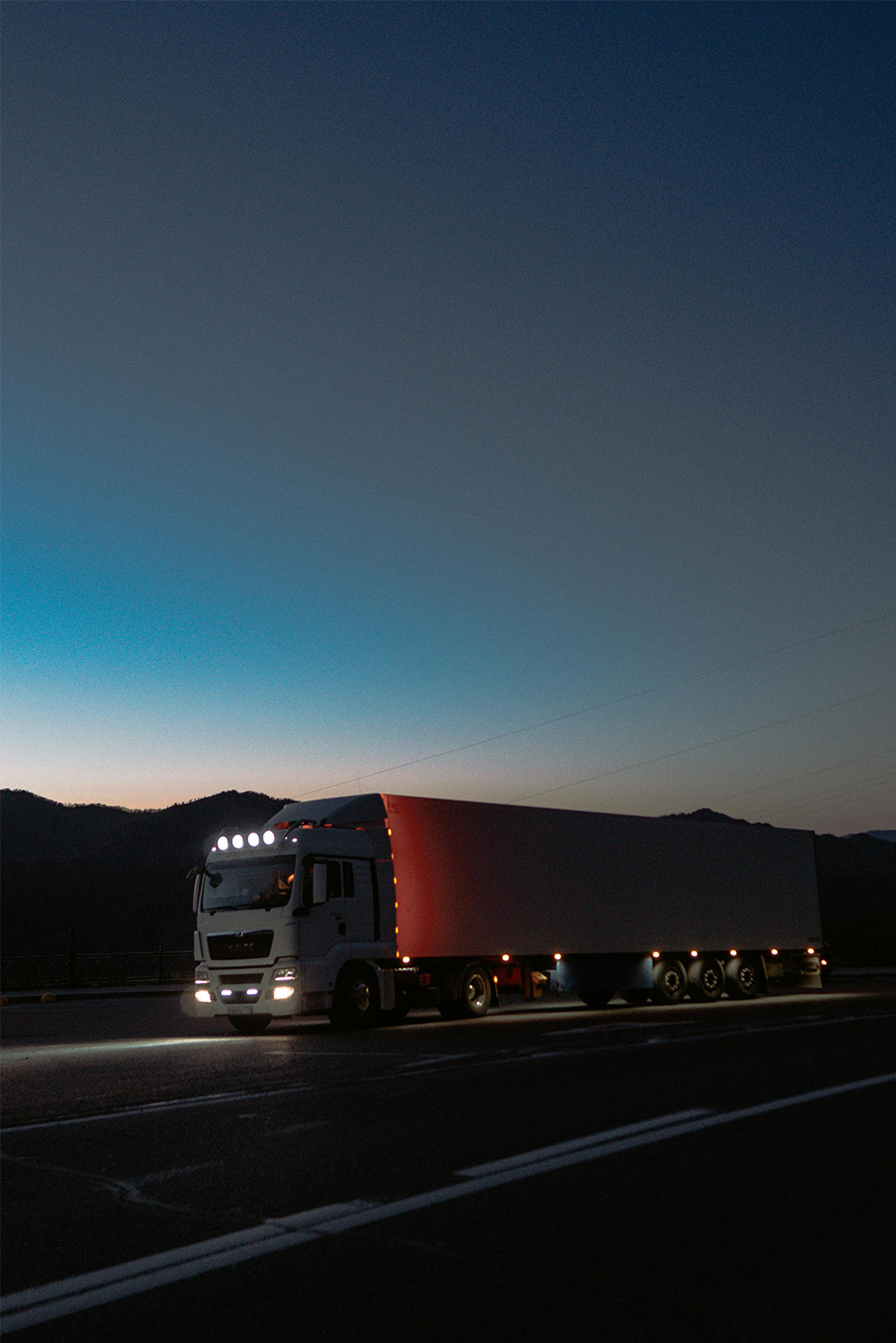 Truck on road at night
